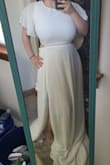 First of all, I ordered the medium size because of my big bust area (breastfeeding.) It's heavier than a normal dress, think jeans vs leggings weight difference. I kinda like that it's a bit heavier. I feel like it makes it more sturdy on the hip area without digging into them for the perfect fit. I got white, but it's kind of see-through. Even with the 3 layers on the bottom half, unless you're matching your undies or covering your skin with white, you'll see it up close. 's 2 sewn flaps by the breast area closer to the armpits, and they are VERY noticeable AND unflattering. The top piece is great for the big bust-size girls like me, but it's a bit saggy on the shoulders. It would look better if it was just an inch tighter by the neck. Of course, being as short as I am, this dress is VERY long for me, almost a foot needs to be taken off. But this wouldn't be a problem for a regular girl. Also to note, it is ONE dress, the top piece has a zipper in the back and the bottom piece has a zipper on the side of the hip. - Brittany B.