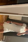 I bought this for my bachelorette the material is thicker than I thought but still lovely! Goes to about mid-thigh and doesn't ride up, very comfortable to wear was very pleased with the purchase. - Rebecca T.