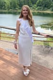 I ordered SO many dresses off of Lulus and this was the clear winner. The neckline is flattening and the midi length is perfect. I originally ordered a small but couldn't zip it up past my rib cage. The medium fit is perfect. It's definitely more of an ivory vs. white (as seen in my sash). - Jaclyn B.