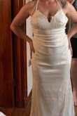 This dress is absolutely beautiful I wanted something simple for an outdoor wedding in September, it's satin and fits like a glove. I will probably need to wear Spanx under it. I won't need a bra which is nice, it does have a train and it might need to be hemmed a little bit so I can walk with more ease and dance, but overall, I'm very pleased with my purchase. - Angela S.