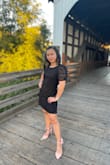 This was a cute dress!! It was slightly loose on the back part, but I was thankful for that!! It didn't show my food baby after dinner lol! Also I thought it was going to hot when I wear it for an outside dinner - on a summer!! It wasn't, it very comfortable. - Suyenne D.