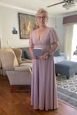 This dress fit perfectly and the quality of the fabric is very good.  The dress is made well and fully lined.  I had to get it hemmed but that wasn't a problem.  I added a broach on the front just to give it a little something, it seemed plain. The only challenges for me were finding a backless bra and that the top easily fell off my shoulders when I sat down.  I had to be very mindful! - Cheri S.