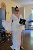 I said yes to the dress and can't wait to wear this in my October 2023 wedding. I wanted to find a perfect bell sleeve lace dress for my boho wedding, but was having a hard time finding one for a decent price! Most of them were $2,000 and up! This is the perfect dress for only $149!!! It's a steal! It is perfect and hugs my body perfectly! It is so comfortable and feels sturdy. The lace is not dainty, so I won't be nervous about the lace all night. Love the trim around the V on the chest. The sleeves are so dreamy and the train is perfect! This is everything I could have ever dreamed about in a budget wedding dress. I love almost everything about this dress. There are almost always some kind of alteration to be made, but I only want to change one small detail. The slip hangs out past the dress slit in the front, so I want to get that sewn together. I may also have a bussell made into the back to keep the train from dragging all night. I'm so happy with my purchase and glad I decided to buy from Lulus! - Kaetlyn M.