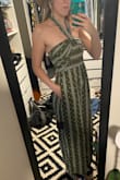 I'm a 4-6 with a little extra in the butt/thigh region, and a small fit me great. Plenty of room in the flowy pant legs. I'm almost 5'9" and it didn't quite come to the floor, I could've easily worn flats but opted for a chunky mule anyway. The smocked top was nice and snug. I like that the tie can be worn a few different ways. I opted for a halter. Got a ton of compliments! - Brenna C.