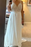 The size 6 was 1/2" too tight right at the top of the zipper and I decided I didn't want anything too tight on my big day even if I could get it zipped up. I exchanged for an 8 and will need some alterations, but it's beautiful and I believe will photograph wonderfully! I'm headed to Europe for my wedding and packable, low wrinkles and lightweight were musts. This checks all the boxes. Can't wait to wear it next summer! - Susan H.