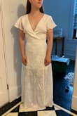 Ordered this dress for my upcoming wedding and I am so pleased with it. I had ordered a few dresses from other sites but this Lulus dress was cheaper, fit better, and seemed to be higher quality. This dress is exactly what I was looking for - super simple, lightweight, and flattering. I did have to get a few alterations - my seamstress is taking in the shoulders for me which will help it fit in the chest. It is low cut but I don't mind. The seamstress is also going to extend the slip to match the full length of the dress - which I think will make it a bit more formal. Also, as a short person, this dress length  fits me perfect as a full-length, not a midi. So keep that in mind if you're ordering. - Kelsey P.