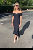 This dress is very flattering. I am 60 and still enjoy wearing flirty and stylish dresses! It is well made and true to size. - Karen L.