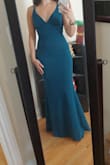 When I first put it on, I was a little worried about how snug it was around the hips, but then remembered it's a mermaid cut. It fits perfectly, I feel great in it, can't wait to wear it for a wedding soon! - Katerina S.