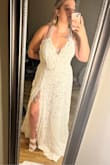 This dress was absolutely gorgeous! I loved the lace material. It felt very high-quality. The side slit was super cute and sexy. I ordered a size too large but that was on me not them. It seemed to fit true to the size I ordered though. It's not quite a fit for my wedding dress but still a gorgeous dress. - FIONA G.