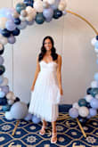 This dress is so cute and was perfect for my bridal shower! It fits TTS for me. The only issue is the straps. They are SO thin and dug into my shoulders. The adjustable strap also didn't stay in place so I had to constantly tighten them when they loosened on their own. So unfortunately I was fidgeting with it most of the day. Overall liked the dress in the pictures, but isn't super practical for long periods of time since it drove me nuts haha. - Leah L.