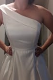 I honestly wasn't sure about buying a wedding dress online, but it fits perfectly and I'm so happy! It is a gorgeous dress, it feels well made, it's got a slip layer, a tulle layer, and the outer layer, and the top has boning which makes it feel super supportive and structured. There's a bit of room in the bust, if you have similar measurements to me but have larger boobs I would say still get it because it will probably fit. The length is quite long so don't worry if you are tall either. I will need to get the length hemmed to fit. The fabric is thick and doesn't breathe at all so after wearing it for an hour I was getting a little sweaty, but I think that is true for most wedding dresses. Shipping didn't take very long either, I'm from Canada so I did have to pay duties which was an extra $30. I absolutely love it and can't beat the price either! - Jenna L.