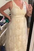 This dress is gorgeous and I can't believe I got it for this price. I have to have it shortened a bit, but everything else fits great. I've got a bit of extra fluff in my middle, so that's part of the tightness. Top is very fitted and flattering on the chest for the size I am. Don't have a picture of the finished product yet, ad I am getting married in 2 months. - Sierra D.