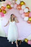 I absolutely loved this for my bridal shower! The skirt was just the right amount of fun/drama and I loved the flutter sleeves. The fabric was so comfortable and I got a ton of compliments. I paired with the lulus shoes with the big bow on the back and felt so bridal. - Katie S.