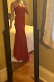 I was a little worried about the lace looking cheap but it's beautiful - a true red. I'm wearing to a wedding in Spain and it's perfectly on theme. My only complaint is that it's a little loose around the stomach, but I'm on the bustier side so it's nothing I'm not used to. - Elizabeth D.