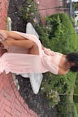 I loved this dress! Its much more pink in person than in the photo they provide. It fit well! I wear a size 10 in pants for reference so the Medium fit my waist perfectly and was close enough up top that it was not sagging at all over my chest. It loved the material and the detailing of the buttons on the wrists. - Sarah W.
