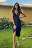 Beautiful blue dress for a wedding, a little more flowy in the middle but has an inner slip so no flashes happen. Tight around the rib cage but nothing I wouldn't send it back over. I love it - Olivia M.