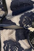 I wore this to a wedding, and the zipper broke before the ceremony even started. It was a little large, especially in the chest area. However, I did receive a ton of compliments. - Kacie B.