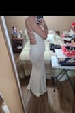 I found out I was pregnant 3.5 months before my wedding. So we bought this as a backup and it is so comfortable and stretchy. I am tall and it's still a little longer if I was wearing heels it would be perfect! - Nicole S.