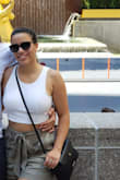 Love this top - just beware that it will shrink ever so slightly (so my busty gals, you'll show more of your midriff over time). It's absolutely adorable and can be worn without a bra without issue. I wear them ALL THE TIME. Highly recommend. - Jordan W.