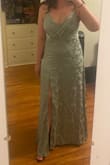 This is probably my favorite dress that I own right now. The dress is long, I'm almost 5'10 and wearing 3-inch heels in the photo. The fabric feels so unique and fun. It's a really flattering dress. The only thing is that one of the fabric folds in the bust sticks out a little if not pinned, but that might be because the bust is a little big on me. - Ross F.