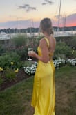 This. Dress. Is. A. Dream!!! I wore this to a summer black tie wedding and received so many compliments! The color, material, fit, and length are spot on and it gives off major Kate Hudson vibes! In the sunlight, the dress is a beautiful golden yellow and in the evening it's looks more champagne yellow. You will not be disappointed!! - Jennifer L.