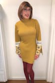 I love sweater dresses, but they usually run large on me, so I ordered this one size down, in a size small, and it fits great.  Even in a small, the neck was not too tight.  Nice and comfy.  Warm and retro chic.  Recommended! - Jo N.