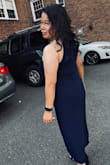 I bought this dress as an alternate for a wedding reception. I never choose long dresses because I'm short, but couldn't stop looking at this one. Read all the reviews and based on my chest size and waist, I went with a M (vs. a S) because a few reviews mentioned there's no give at the waist.  So glad I went with a M! I was also worried it would be too long and I'd have to get it hemmed, but the dress made me feel beautiful and strangely taller, I left it unhemmed. It is very flattering and hides my tummy too! Can't wait to wear it this weekend! Paired with navy suede heels. - THERESA D.