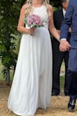 I love this dress. I am so glad I decided to go with this one. I just had my wedding and I am 20 weeks pregnant with my 6th baby. It fits perfectly for my bump and was great for an august wedding in the pacific northwest. I wore a nude bra under. The length does run a little long but it was pretty and flowy. The dress itself has weight to it as well. We had it dry cleaned the week of the wedding to keep out all the wrinkles for the big day. The only thing I can say about this dress that is even negative is that the zipper over the lace does get a little hard to zip and can get stuck. I ended up putting bar soap on it to make it move. The customer service at Lulus is above and beyond. They were willing to ship me a new dress and refund the cost when I told them about the issue. I have never experienced such kindness from a online clothing store. Will be recommending this website to everyone and coming back to buy a dress again for a special event. Thank you Lulus for making my special day perfect! - Rachel B.