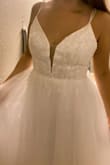 I purchased my first wedding dress almost a year ago and was never truly happy with it. I kept searching and finally decided to try Lulus. I instantly fell in love with this dress and other companies sell similar styles for $600+! I tried it on and it fit just perfectly. I'm usually between a size 8-10 and the 10 felt like it was made for me. The dress does not have stretch so I would recommend going with the larger size if you're in-between or unsure. I cried true happy tears after trying this on and I cannot wait to wear this on our wedding day. Thank you Lulus for saving the day!! - Elizabeth S.