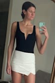 I wear this bodysuit with countless bottoms. It's the perfect easy top but still a little sexy as well. I paired it with another Lulus item, of course, a cute skort! - Kellyn S.