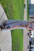 Bought for my daughter's sweet 16 ball and she absolutely loves it! Beautiful light blue and so glittery. She loves it. It was long without the shoes but once she put on her 5.5 in heels on it is perfect. The slit is nice so you show off your cute shoes. - Elizabeth C.