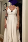 Out of a handful of dresses I tried, once I put this dress on, I LOVED it! It is so effortless and pretty and comfortable. I have a pear shaped body and I have a hard time dress shopping because many dresses hit me at the hips and make me look like wide, but this dress felt like it was made for my body. I'm so excited to wear it for my wedding and to know I'll feel so comfortable the entire day! For bigger chested women: you may need to get it tailored a bit. I am a 34H bust and although the size 10 fit me perfectly everywhere, the back zipper is just shy or closing all the way, so I'll need to get that adjusted. Also you can totally see the pockets, but again, quick fix at the tailor. I highly recommend trying this dress. I just love it. (The photo attached is pre-tailoring, hence some of my bra showing!) - Ana M.