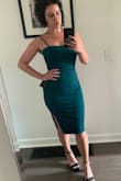 The material is thick and the straps are adjustable which I like for my height. It is stretchy but holds its shape. I went with a medium. The small was unflatteringly tight on me, the slit didn't fall right. The neckline is super flattering. I won't wear a bra but maybe some pasties. My seamless underwear shows even through the thicker fabric so I will have to find something else. The length is just what I wanted. Feels appropriate for the tightness of the dress at a formal event. It's going to be a showstopper and I can't wait to wear it! (The zipper is only not fully zipped because it was hard to do myself.) I'm obsessed with the emerald color! - Laura D.