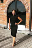 This dress fits like a glove. The dress comes up high enough in the back to wear shape wear. I wore it for summer wedding. The thick material is better for fall or spring. - Coco T.