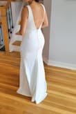 I ordered multiple wedding dresses from Lulus and while I loved every one of them in a different way, there was just something special about this beauty. The dress is made out of a very comfortable fabric, fits perfectly and the details in the back add something extra special. I wanted something simple and classy for my beach wedding elopement and said Yes to this dress! Love it! - Zuhal C.