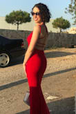 This dress is so flattering. It fits really nicely and hugs your body without feeling tight. The color is a bright red (seemed neutral, not orange- nor blue-toned). I wore this to my cousins wedding in Lebanon in August; it was pretty hot & humid out, but I was comfortable. I wore 3-inch heels and the length was great. Bonus: no ironing needed; I just hung it the day before. - Rula K.