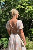 This dress was so much fun and easy to wear! I loved the pockets and open back. The medium fit me but was a little tight around my ribs so sized up. It fit great besides being a little big in the bust. I got so many compliments!! I wore it to a summer wedding and it was exactly what I was looking for! The sleeves were a cute touch! - Kelsey H.