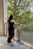 Great dress, but it is definitely long. I am 5'1 and wore 3-4inch heels and the dress still touched the floor. Other than that, it was perfect. There is no stretch, so be careful about sizing. Got compliments from so many people at the wedding. - Celina M.