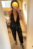 This jumpsuit has a unique way to tie it which I liked since it controlled how tight you can make it around your chest. I was able to tie it on my own without someone helping me. The outfit fits perfectly. - Mary S.