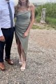 The dress was absolutely stunning and I loved wearing it to an outdoor mountain wedding. The hem of the slit ended up showing when I was wearing the dress. I tried ironing it but that didn't do anything. I don't think other people noticed but it did bother me.
I ordered both a small and a medium. The small wouldn't zip up my chest, but fit perfectly on my hips. The medium zipped but was a little loose on my hips. I don't have many curves, so this is pretty typical for me. - Ashley H.