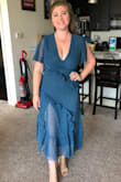 I got this as a possible option for my engagement pictures and it's really pretty! I ended up returning only because I found a more flattering dress for me personally, but I wouldn't have a problem using this one. There's a hidden zipper on the side and the drop waist and ruffle effect are flattering on a shorter person because it elongates. I ended up going with one with full sleeves and a little less boob, but again, this was great quality! - Leah W.