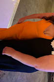 First off , let me just say that the way this dress hugs your body I'm obsessed with, but did have small issues. The chest area - if you chose a bra (strapless) shows a bit but you could also go braless if comfortable that was my plan but I forgot the other spanx etc. 
The material is heavy the bride picked this out for her summer wedding disco and it was a hot day, and I was sweating - my recommendation would be to order this dress in the fall where it's light crisp air. 
The color is more orange vs tangerine and it's cute with tan heels. It is long depending I'm 5'2 so I had to have it altered.
Overall fun cute many compliments . - Mary L.
