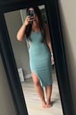 Obsessed with this sage color (but Im biased as it was my bridesmaids dress color for my wedding)! The fabric is stretchy which is PERFECT for those of us with big boobs and a smaller waist! Its double lined which makes it pretty thick. Gave four stars because the liner has  side seams, as does the dress and since they aren't sewn together all the way it's kind of a pain to get the seams to stay lined up. If they aren't, you can see the liners seams right though the dress and it looks pretty odd and lumpy. - Alaina Q.