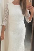 This dress fits like a glove without being restricting. The lace is so soft! It's the perfect, classic gown for my vow renewal! - Amy G.