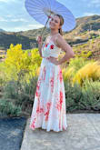I absolutely love the print of this dress and that's what sold me on it. I wore it to a destination wedding in Malibu, California and thought it was perfect. The fit was a little tricky...my recommended size by Lulu was a L, but I absolutely needed a medium. I would have been swimming in a large, so I'm not sure what's off in the fit algorithm for me. I'm 5'5'' and wore approximately 3 inch heels, but a hem was still essential. My seamstress also made alterations to the bust area. She sewed cups in, b/c all the strapless bras I tried were visible while wearing the dress. Adhesive bras do not work for me, and I personally think they're impossible for anyone over a B cup. It was also 100 degrees at an outdoor wedding and they would have fallen off. This is probably my biggest critique. I think the dress should have cups built in - it was a pain to get these alterations, but worth it in the end. Seamstress also had to take in the cup area a little to make it lie flush. The snap also popped open a lot. - Mary R.