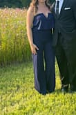 Absolutely love this jumpsuit! I wore it for a wedding and received many compliments. It fit like a glove and was a perfect length; the color was fire! You don't have to wear a bra but I did for a little more support. My only complaint would be the zipper, it's dainty and at some points I thought it was going to break, every time I needed it zipped up. I would still recommend the jumpsuit hands down! - Ashton E.