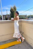 Wore this dress at my bridal shower this past weekend-it was perfection! Loved the midi length on me (5 foot 8 inches tall) and the lace detail at the bottom of the dress. Received so many compliments. I am a size 6 and medium in most dresses-had to return this dress for a small, so I would say it runs big in the thigh/skirt area. The bust and ribcage were snug and offered good coverage, with adjustable straps. The first dress I ordered came with a snagged zipper in the back and Lulus sent me a replacement dress at no charge within three days. Excellent customer service. And the shoes are Lulus too! Tall women should definitely buy this dress! - Yasmean T.