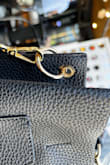 I was hesitant to buy this because some of the earlier reviews detailed some quality issues but it looks like they've made improvements in the construction (see photo) to resolve them. I'm really happy with this bag. The material seems durable and it isn't too big. Definitely a good buy for the price. - Kahli S.