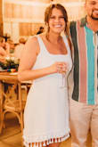 I'm typically a medium, but I ordered this dress in a large since that was all they had left in stock. A medium would've fit better, but the large still fit fine. I absolutely loved this dress for my wedding reception! The tassels made it so fun for our Florida wedding. Highly recommend!! - Jordyn R.