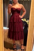 I loved this dress but ended up going with the pink instead. The small fit me perfectly and the medium was too big. The dress has a loose bottom part so I would choose the M if you have a bigger chest and waist, but both S and M will fit different sizes on the bottom. I rarely go braless but I could in this one and it actually would have been too tight with the bra. Would not suggest for larger busted ladies as the cups don't really fit bigger boobs. - Lindsay W.